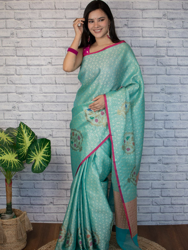 Banarasi Kora Muslin Saree With Tanchoi Weaving and Floral Border-Aqua Blue